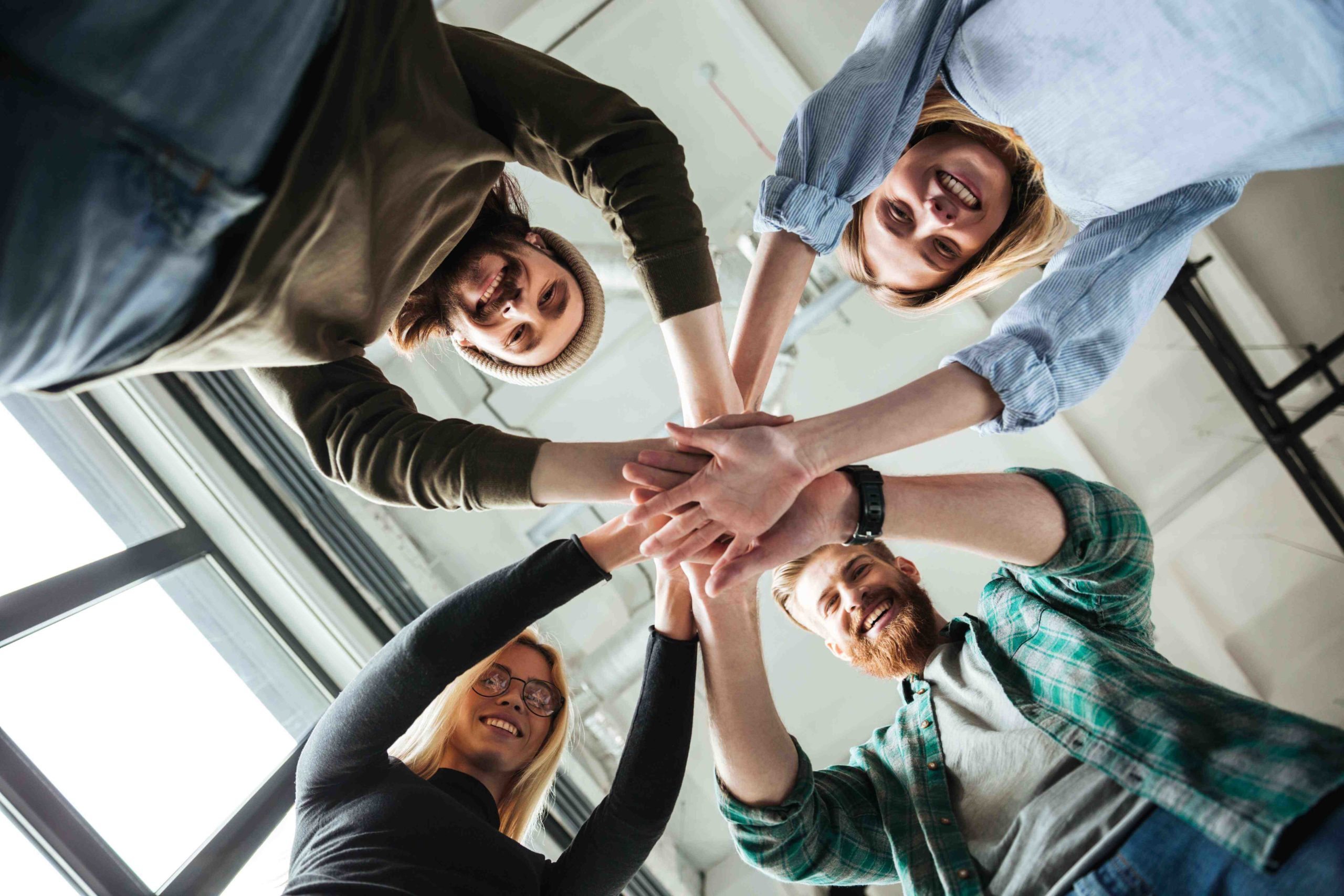 colleagues-in-office-holding-hands-of-each-other